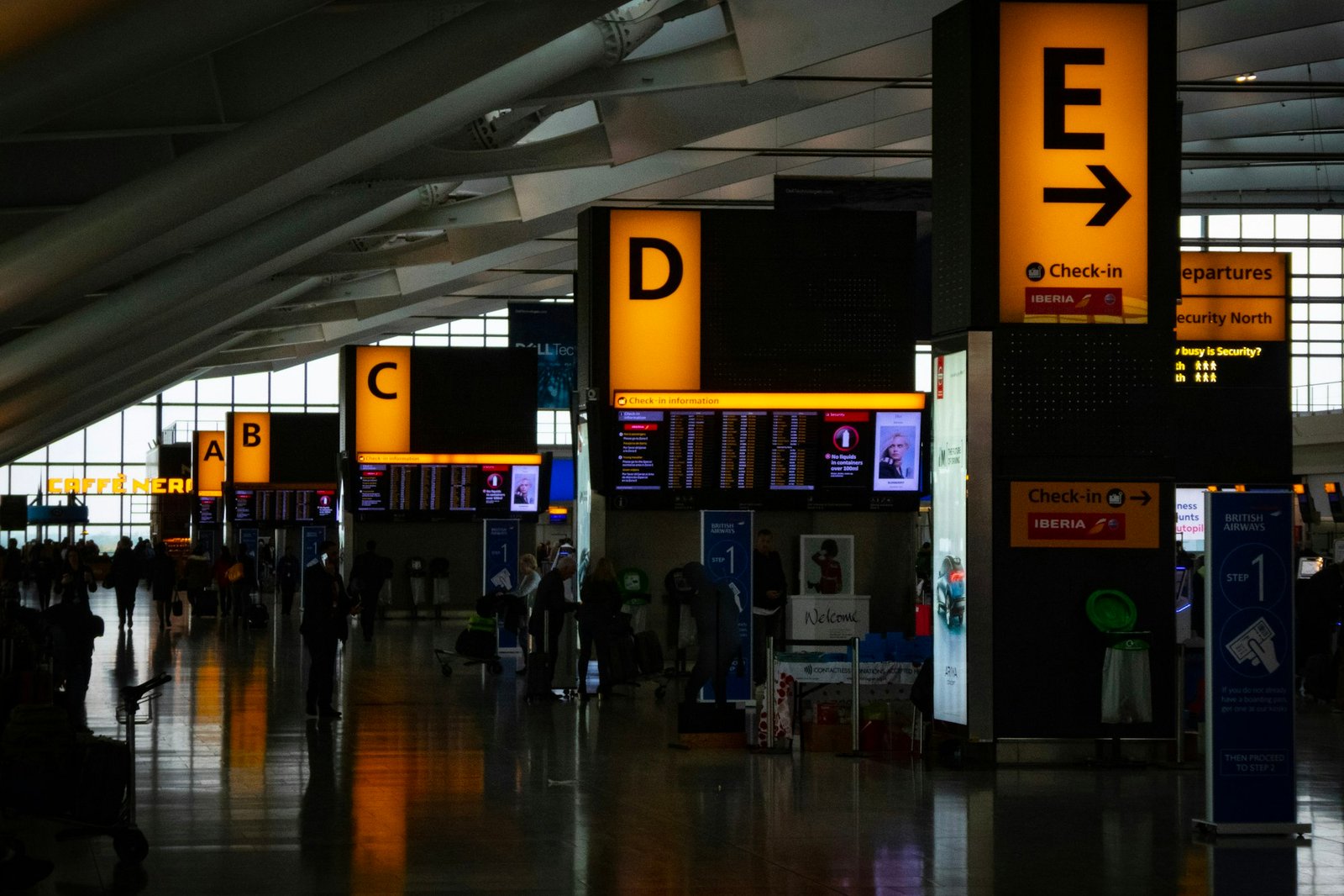 Airport departures hall with gate signs